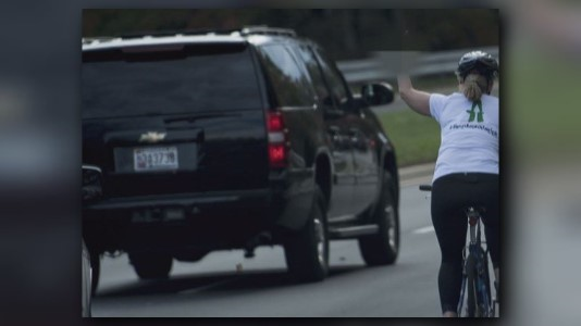 Woman who flipped off president's...